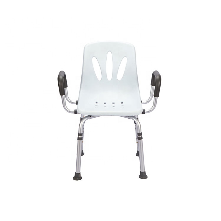 White moulded shower chair with a slotted backrest, grey padded arms and height-adjustable aluminium legs